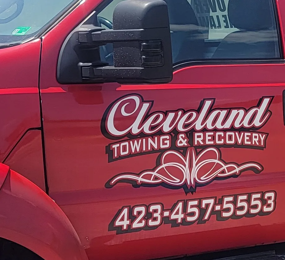 The Cleveland Towing & Recovery decal on the truck door, reading (423) 457-5553
